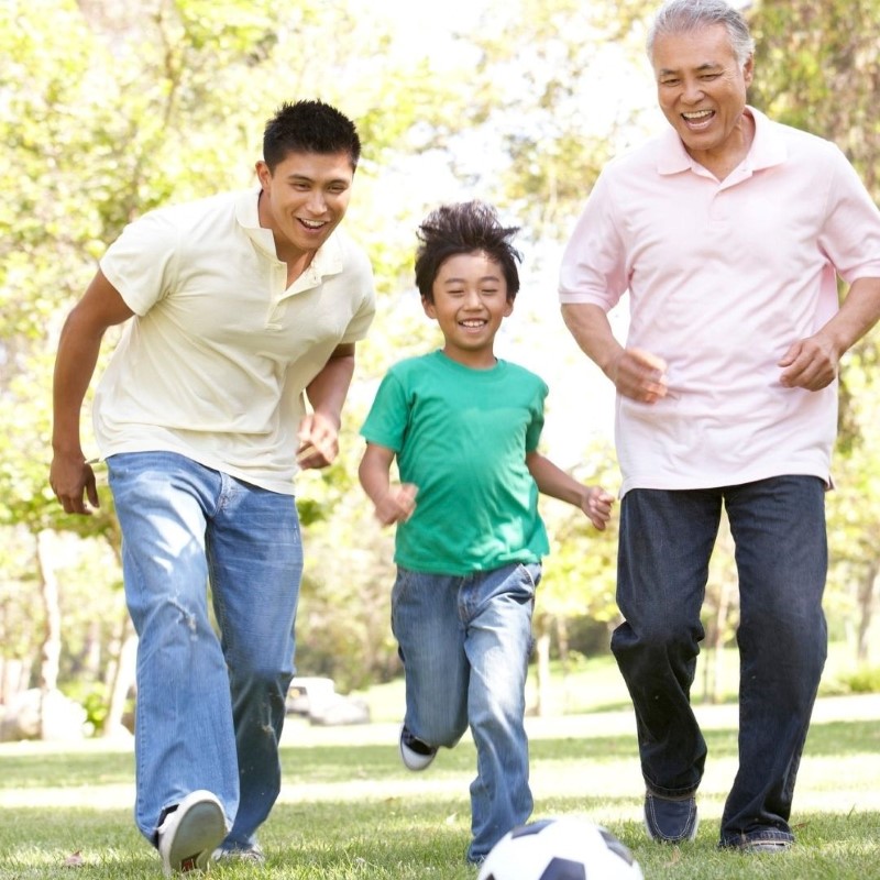 Three generations of men playing soccer.jpg